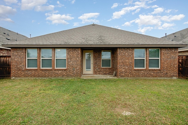4605 Ashmark Rd, Little Elm, TX 76227 - rear view of house featuring roof with shingles, brick siding, and a fenced backyard