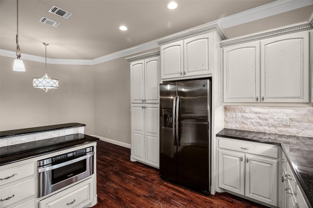 5807 Pebble Beach Dr, Granbury, TX 76049 - kitchen with stainless steel fridge, dark countertops, crown molding, dark wood-type flooring, and baseboards