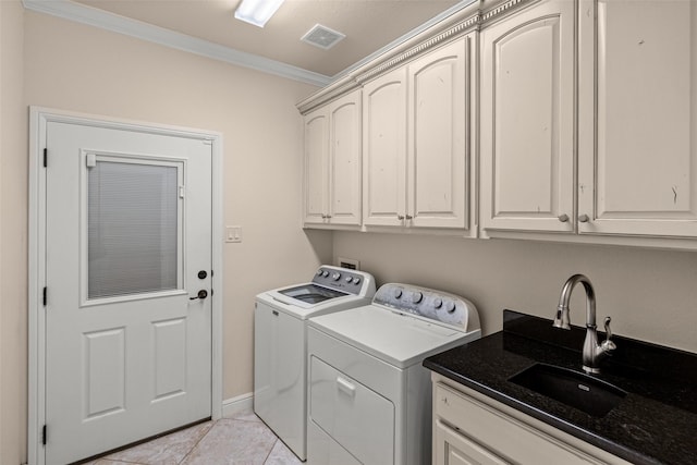 5807 Pebble Beach Dr, Granbury, TX 76049 - laundry area with cabinet space, separate washer and dryer, crown molding, and light tile patterned floors