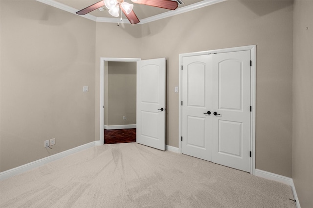 5807 Pebble Beach Dr, Granbury, TX 76049 - unfurnished bedroom with crown molding, carpet, baseboards, a closet, and a ceiling fan