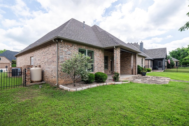 5807 Pebble Beach Dr, Granbury, TX 76049 - view of side of home with brick siding, a shingled roof, central AC unit, a patio, and a chimney