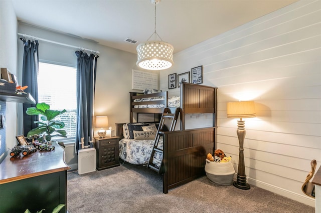 carpeted bedroom with multiple windows and visible vents