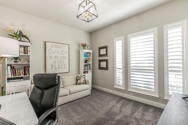 office area featuring an inviting chandelier, carpet flooring, and baseboards