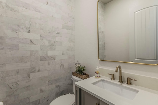 bathroom with toilet and vanity