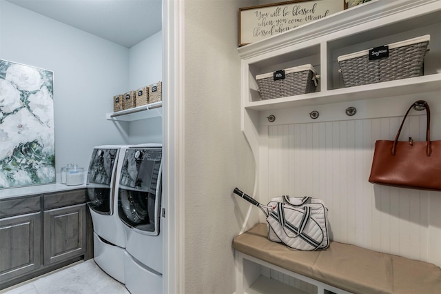 washroom with laundry area and washer and dryer