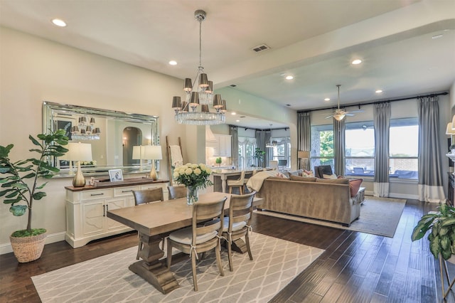 dining space featuring baseboards, ceiling fan with notable chandelier, recessed lighting, and dark wood-type flooring