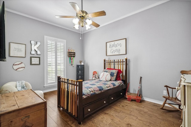 bedroom with baseboards, ornamental molding, dark wood finished floors, and ceiling fan