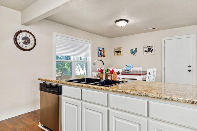 kitchen featuring dishwasher, baseboards, dark wood-style flooring, visible vents, and a sink