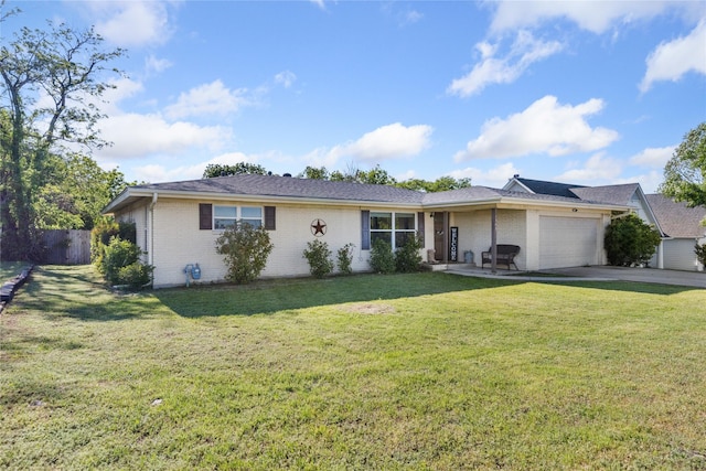 ranch-style home with an attached garage, fence, concrete driveway, a front yard, and brick siding