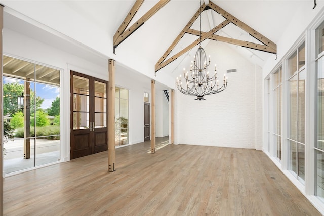 5747 Charlestown Dr, Dallas, TX 75230 - unfurnished sunroom featuring an inviting chandelier, visible vents, french doors, and beamed ceiling