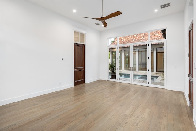 5747 Charlestown Dr, Dallas, TX 75230 - empty room with light wood-type flooring, visible vents, baseboards, and ceiling fan