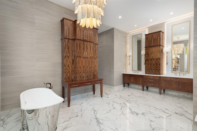 5747 Charlestown Dr, Dallas, TX 75230 - bathroom with recessed lighting, marble finish floor, a sink, a freestanding bath, and double vanity