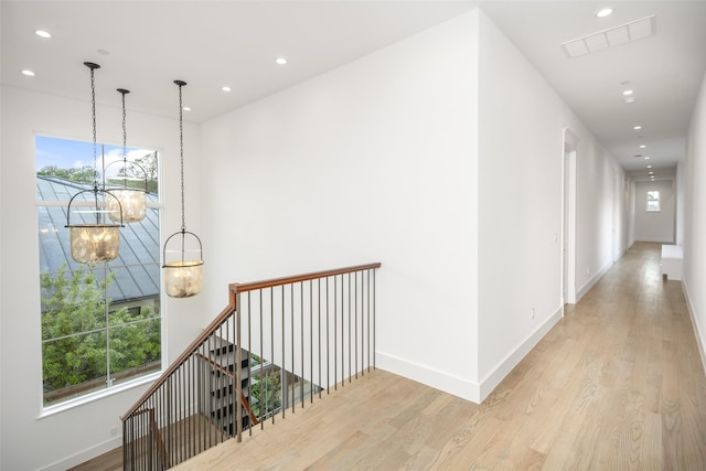5747 Charlestown Dr, Dallas, TX 75230 - hall featuring recessed lighting, a chandelier, visible vents, and wood finished floors