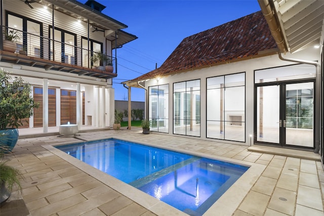 5747 Charlestown Dr, Dallas, TX 75230 - view of swimming pool with a patio, french doors, and a pool with connected hot tub