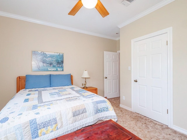 bedroom featuring ornamental molding, light colored carpet, a ceiling fan, and baseboards