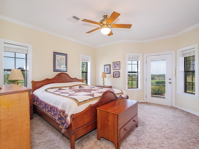 bedroom with ornamental molding, light carpet, access to outside, and multiple windows