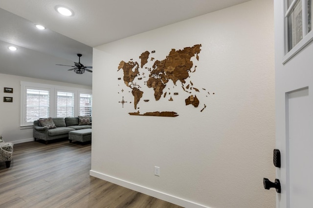 interior space with a ceiling fan, baseboards, recessed lighting, and wood finished floors