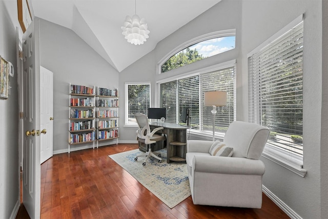 home office featuring vaulted ceiling, baseboards, and hardwood / wood-style flooring