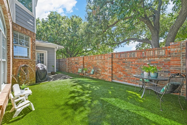 view of yard with a fenced backyard