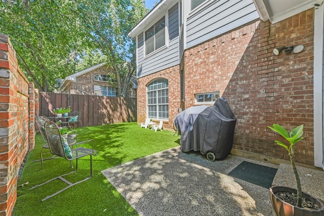 exterior space with a patio and a fenced backyard