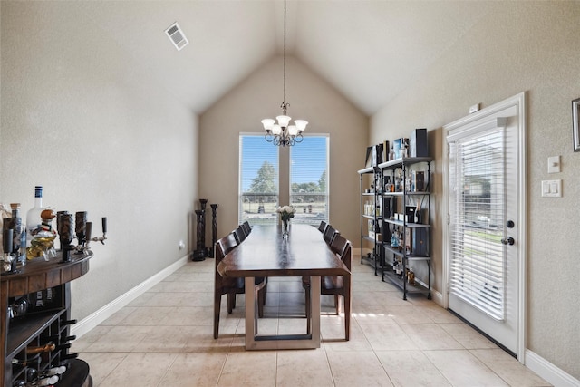 dining space with lofted ceiling, a notable chandelier, baseboards, visible vents, and light tile patterned flooring