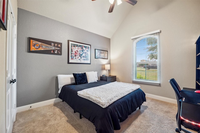 bedroom with lofted ceiling, light carpet, baseboards, and a ceiling fan