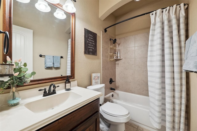 full bathroom with toilet, vanity, a textured wall, and shower / bathtub combination with curtain