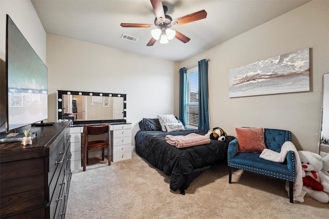 bedroom featuring a ceiling fan, light carpet, and visible vents