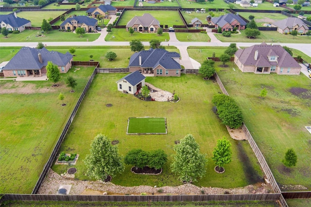 birds eye view of property with a residential view
