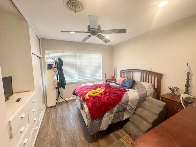 406 Mockingbird Ln, Chico, TX 76431 - bedroom with a ceiling fan, baseboards, visible vents, and wood finished floors