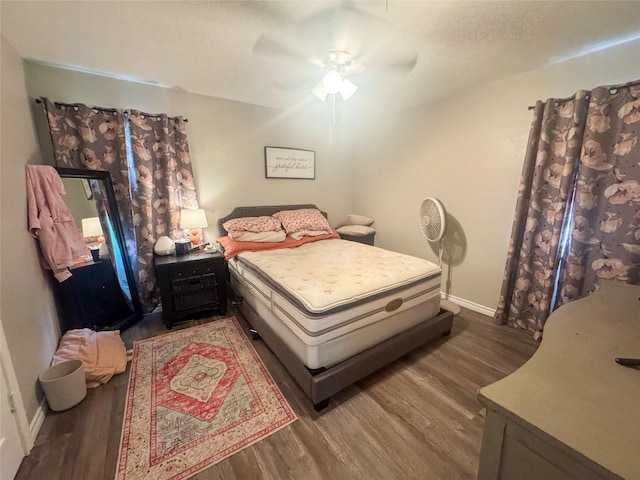 406 Mockingbird Ln, Chico, TX 76431 - bedroom with baseboards, a ceiling fan, and wood finished floors