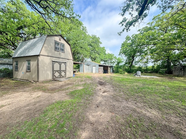 406 Mockingbird Ln, Chico, TX 76431 - view of outbuilding featuring driveway and an outdoor structure
