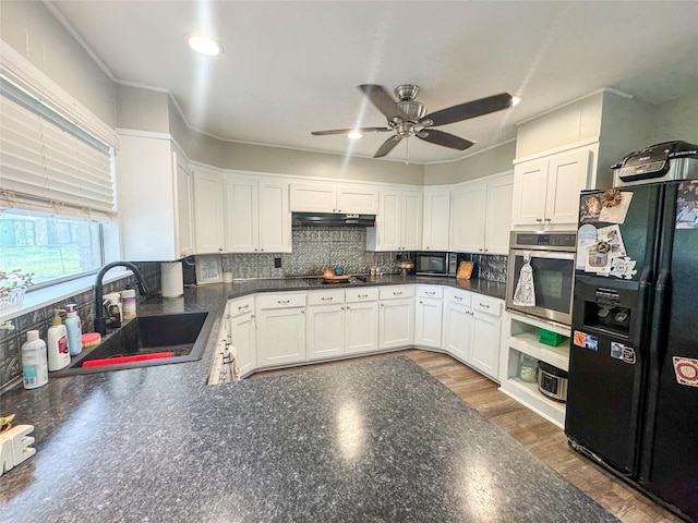 406 Mockingbird Ln, Chico, TX 76431 - kitchen featuring black appliances, dark countertops, ceiling fan, and a sink