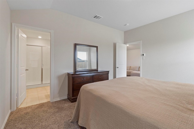 1628 Seadrift Dr, Forney, TX 75126 - bedroom featuring light colored carpet, light tile patterned flooring, ensuite bathroom, and lofted ceiling