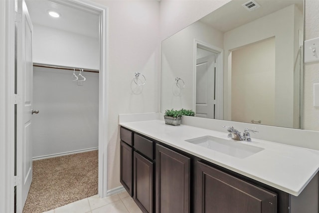1628 Seadrift Dr, Forney, TX 75126 - bathroom featuring vanity, a walk in closet, and tile patterned flooring