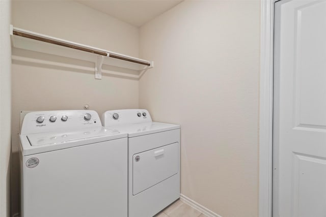 1628 Seadrift Dr, Forney, TX 75126 - washroom with separate washer and dryer and light tile patterned floors