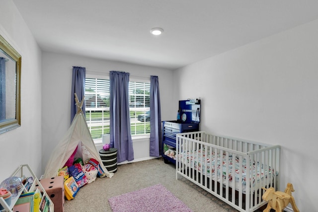 carpeted bedroom with baseboards