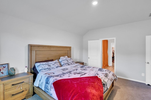bedroom featuring visible vents, baseboards, lofted ceiling, and carpet floors
