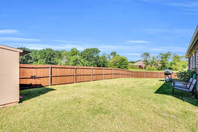 view of yard featuring a fenced backyard