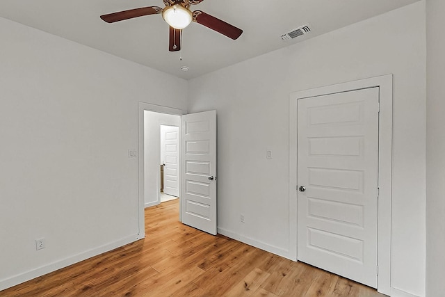 503 W Martin Luther King St, Denison, TX 75020 - unfurnished bedroom with baseboards, light wood finished floors, visible vents, and a ceiling fan