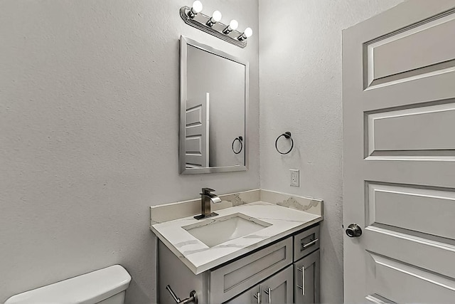 503 W Martin Luther King St, Denison, TX 75020 - half bathroom with toilet and vanity