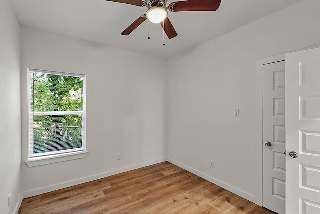503 W Martin Luther King St, Denison, TX 75020 - unfurnished room featuring a ceiling fan, baseboards, and light wood finished floors