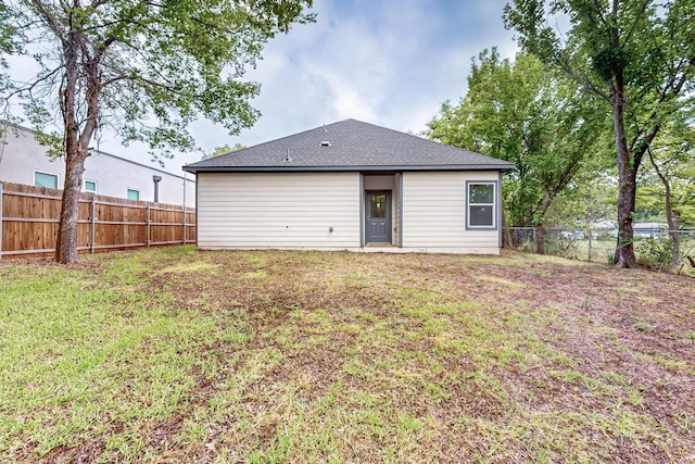 503 W Martin Luther King St, Denison, TX 75020 - rear view of house with a lawn and a fenced backyard