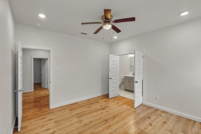 503 W Martin Luther King St, Denison, TX 75020 - unfurnished bedroom with baseboards, recessed lighting, light wood-style flooring, and visible vents