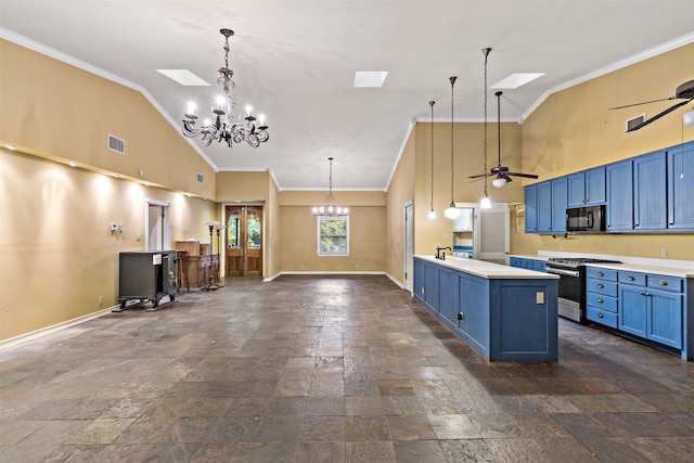 kitchen with high vaulted ceiling, a skylight, stainless steel gas stove, and blue cabinetry
