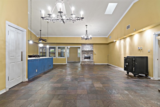 unfurnished living room featuring stone tile flooring, visible vents, high vaulted ceiling, and a notable chandelier
