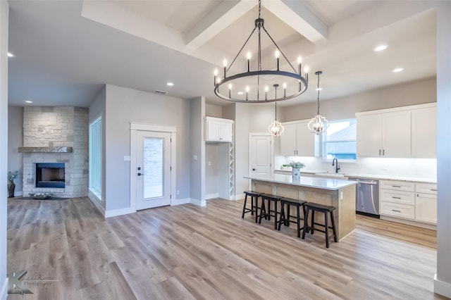 3342 Torrey Pne, Abilene, TX 79606 - kitchen featuring dishwasher, an inviting chandelier, open floor plan, a kitchen island, and beamed ceiling