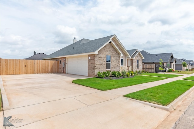 3342 Torrey Pne, Abilene, TX 79606 - single story home featuring driveway, brick siding, fence, an attached garage, and a front lawn