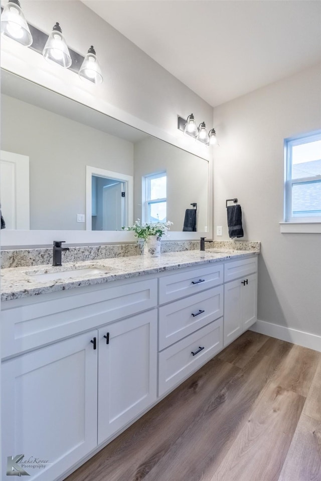 3342 Torrey Pne, Abilene, TX 79606 - full bath featuring double vanity, plenty of natural light, wood finished floors, and a sink