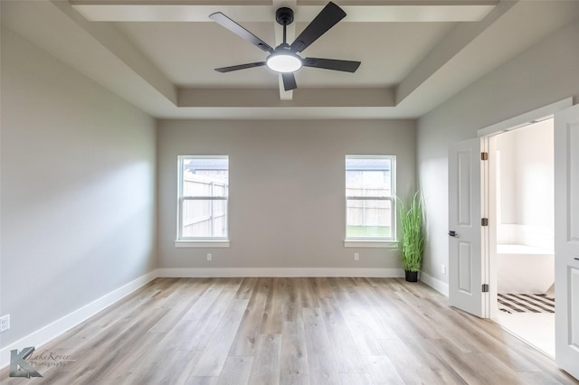 3342 Torrey Pne, Abilene, TX 79606 - unfurnished bedroom with a tray ceiling, baseboards, light wood finished floors, and a ceiling fan
